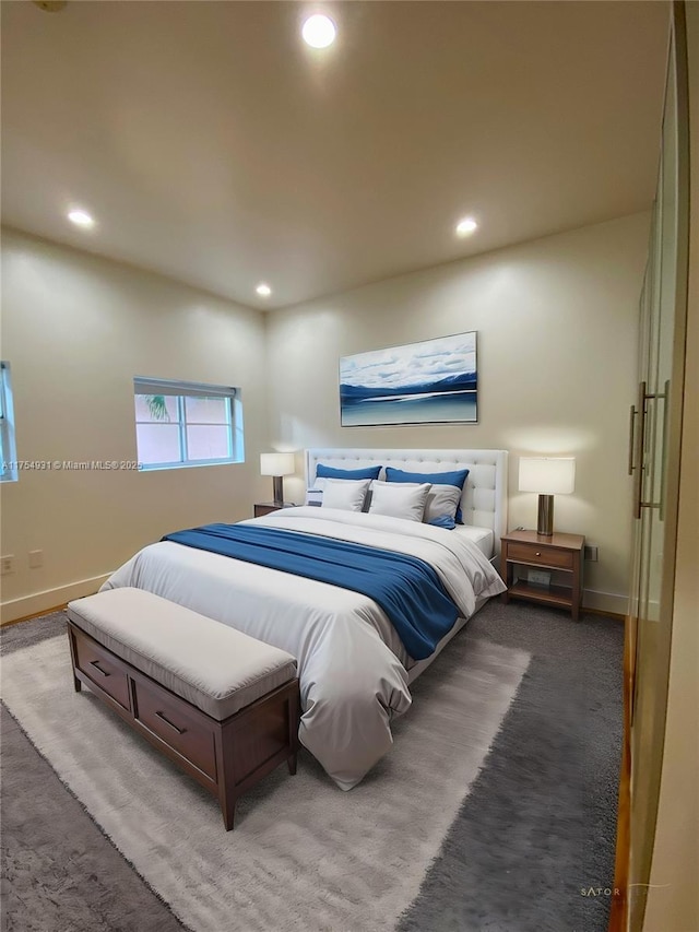 bedroom featuring baseboards and recessed lighting