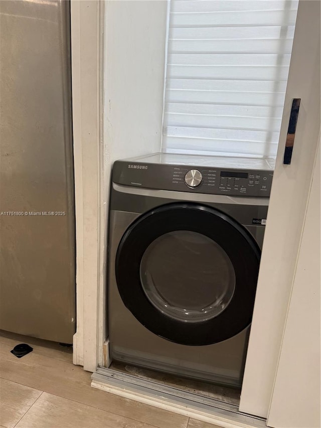 laundry room featuring laundry area and washer / clothes dryer