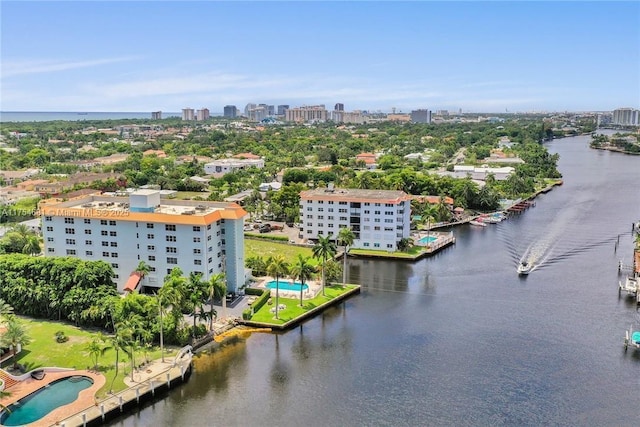 drone / aerial view featuring a view of city and a water view