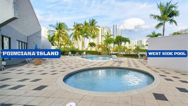 430 Poinciana Dr Unit 1710, Sunny Isles Beach, FL 33160 - pool featuring a patio area and a city view