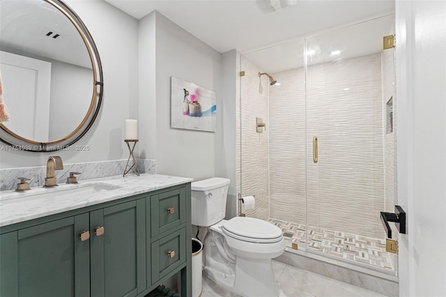 full bathroom featuring toilet, tile patterned flooring, a shower stall, and vanity