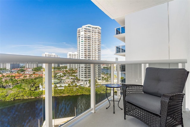 balcony featuring a water view and a view of city