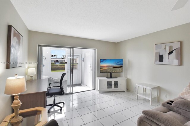 2775 W Dudley Dr W Unit E, West Palm Beach, FL 33415 - office area with light tile patterned flooring and a textured ceiling