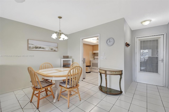 2775 W Dudley Dr W Unit E, West Palm Beach, FL 33415 - dining area featuring a chandelier and light tile patterned flooring