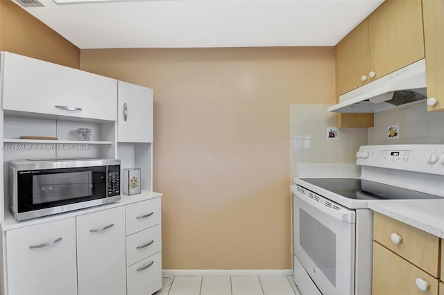 2775 W Dudley Dr W Unit E, West Palm Beach, FL 33415 - kitchen with white electric stove, stainless steel microwave, under cabinet range hood, light countertops, and open shelves