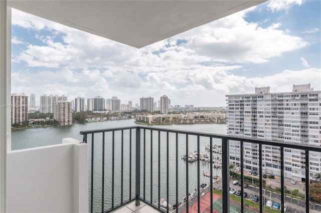 balcony with a view of city and a water view