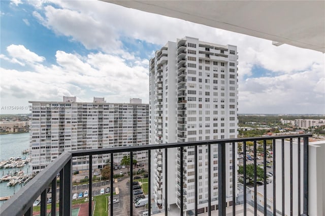 balcony featuring a water view and a view of city