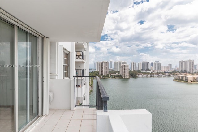 balcony featuring a view of city and a water view