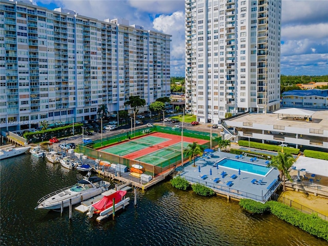 drone / aerial view featuring a view of city and a water view