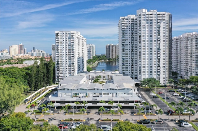 birds eye view of property with a view of city and a water view