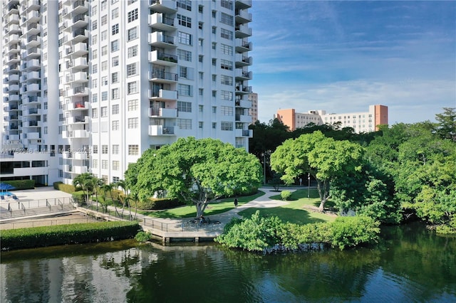 view of property's community featuring a water view and a city view