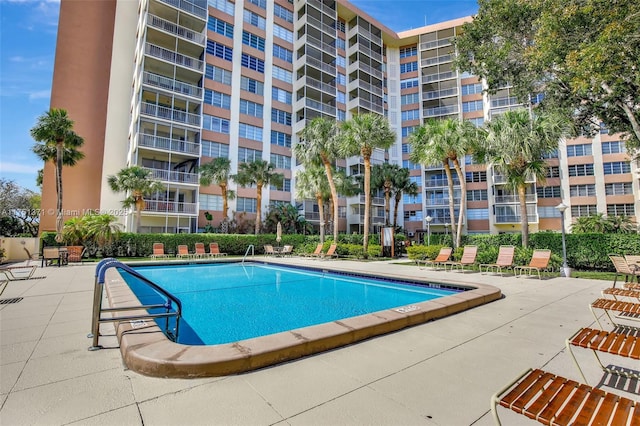 community pool with a patio area