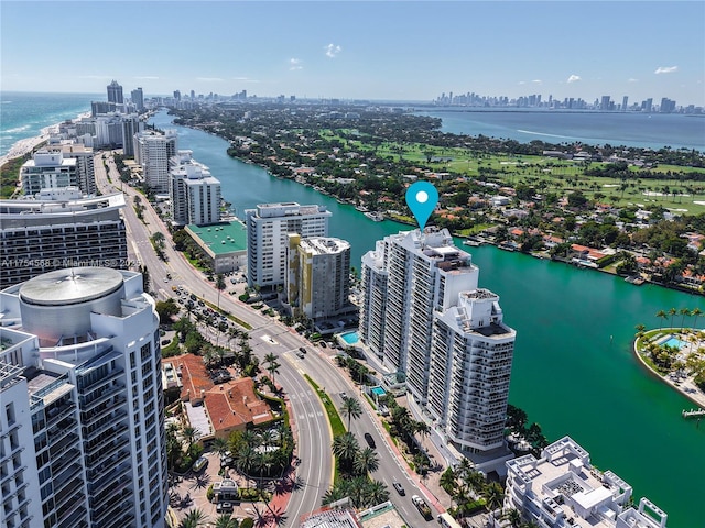 drone / aerial view with a view of city and a water view