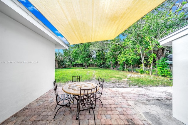 view of patio with a fenced backyard and outdoor dining space