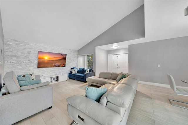 13456 SW 108th St Cir N, Miami, FL 33186 - living room featuring baseboards, high vaulted ceiling, and an accent wall