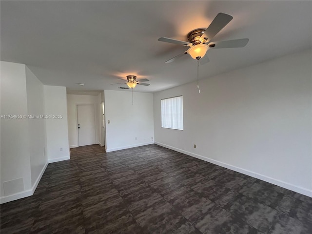 spare room featuring baseboards