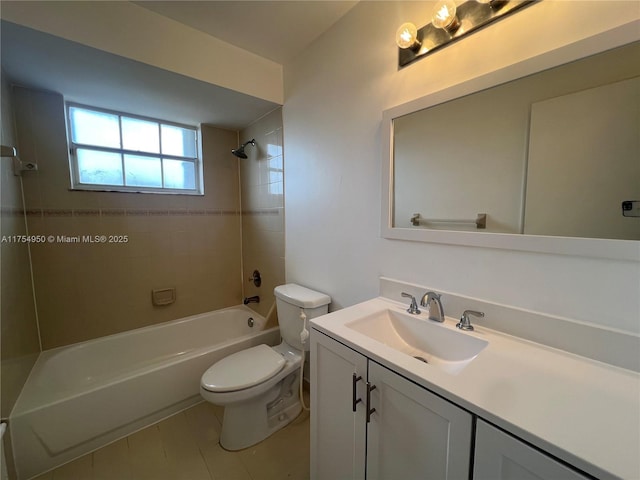 bathroom featuring toilet, vanity, and shower / bathing tub combination