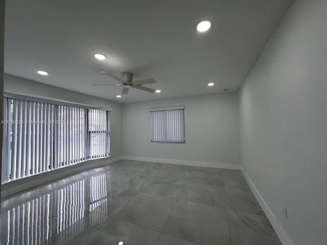 unfurnished room featuring ceiling fan, baseboards, and recessed lighting