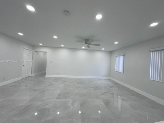 spare room featuring baseboards, a ceiling fan, and recessed lighting