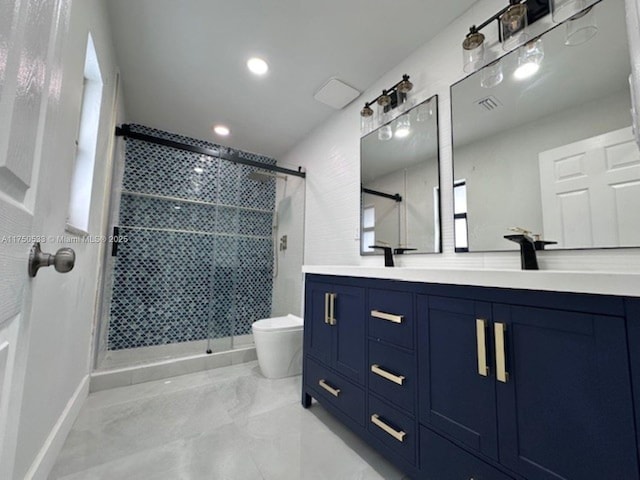 full bath with toilet, a sink, visible vents, double vanity, and a stall shower