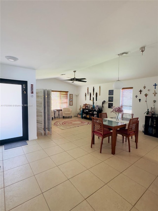 dining space featuring a wealth of natural light, ceiling fan, and light tile patterned flooring
