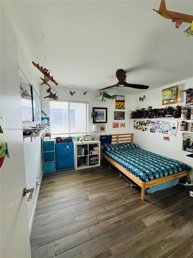 playroom with a ceiling fan and wood finished floors