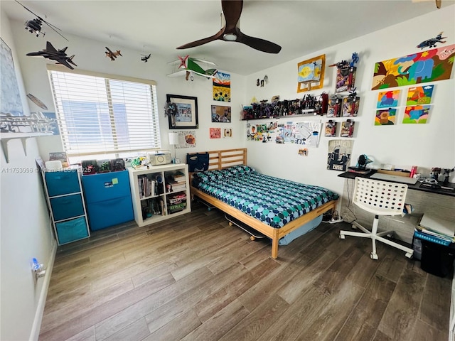 bedroom featuring wood finished floors and ceiling fan