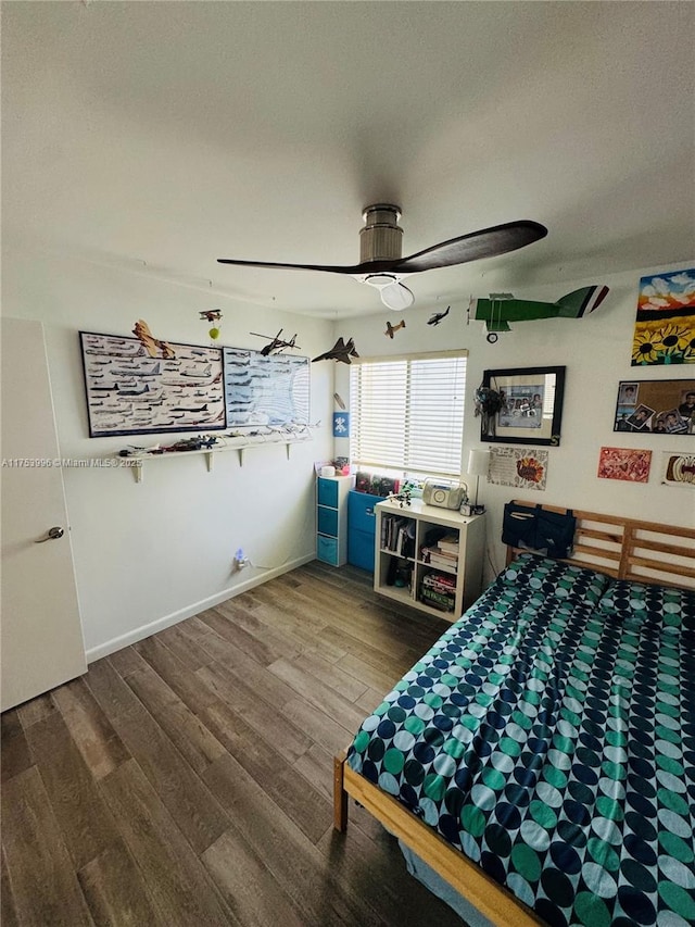 bedroom featuring ceiling fan and wood finished floors