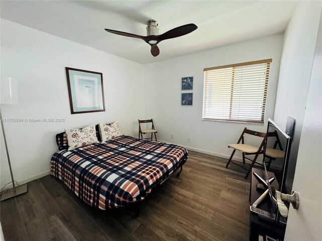 bedroom with baseboards, a ceiling fan, and wood finished floors