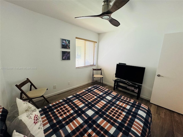 bedroom featuring wood finished floors, ceiling fan, and baseboards