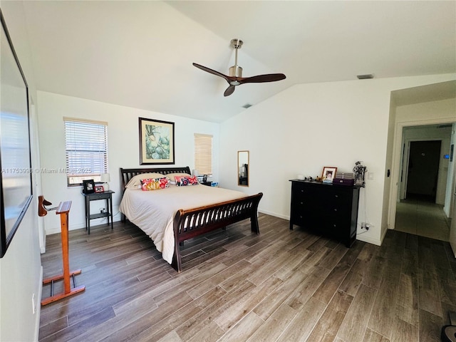 bedroom with visible vents, wood finished floors, vaulted ceiling, and a ceiling fan
