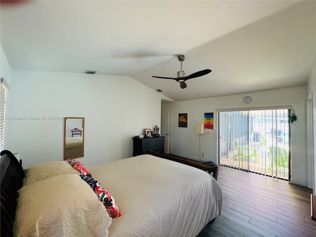 bedroom with visible vents, ceiling fan, wood finished floors, access to outside, and lofted ceiling
