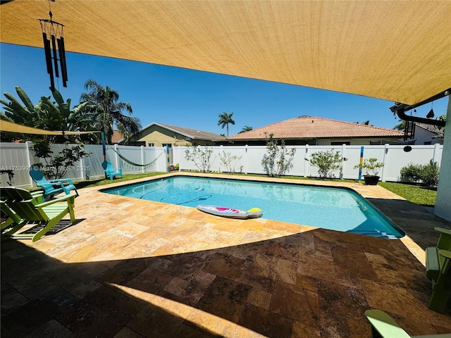 view of pool featuring a fenced in pool, a patio, and a fenced backyard