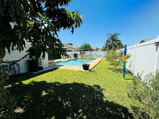 view of pool featuring a fenced backyard, a fenced in pool, and a lawn