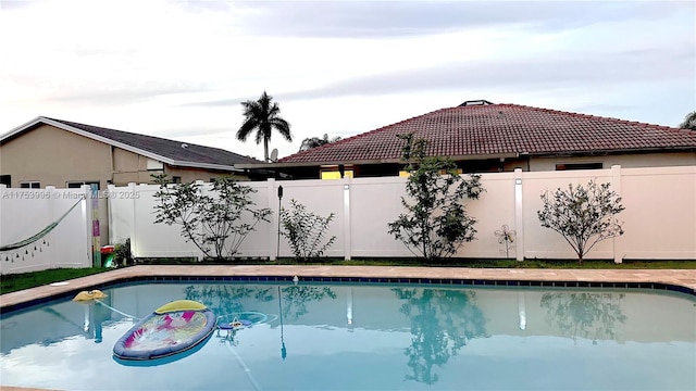view of pool with a fenced backyard and a fenced in pool