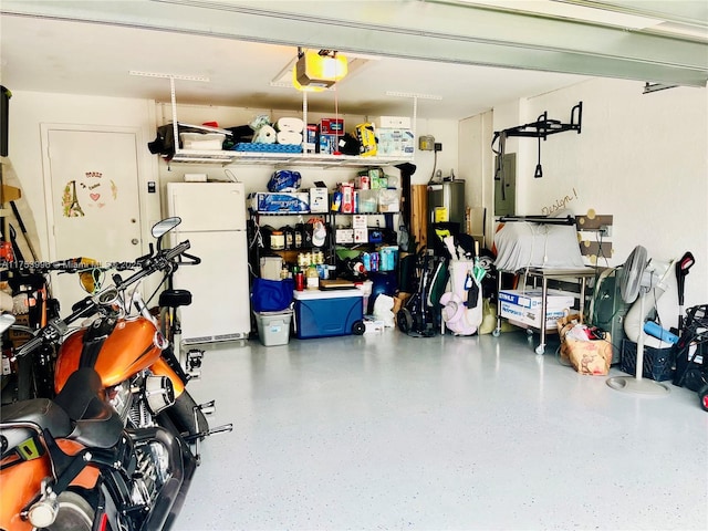 garage with a garage door opener, freestanding refrigerator, and electric panel