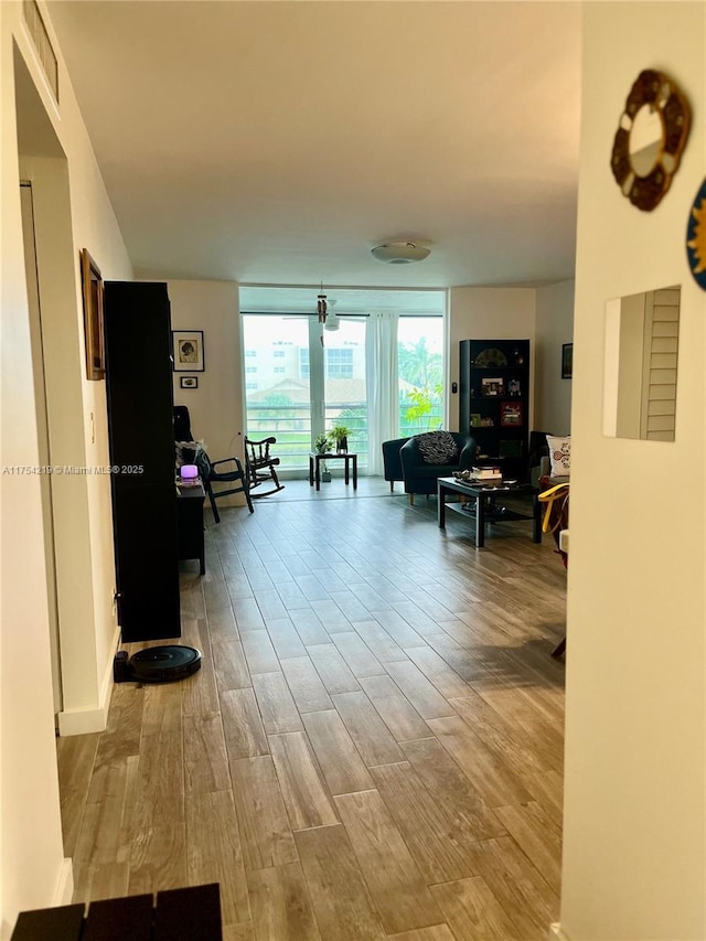 415 SE 11th Ter Unit 205, Dania Beach, FL 33004 - living area with wood finished floors and visible vents