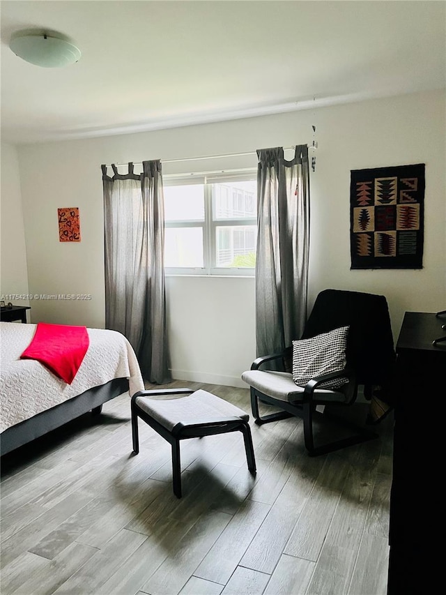 bedroom with wood finished floors