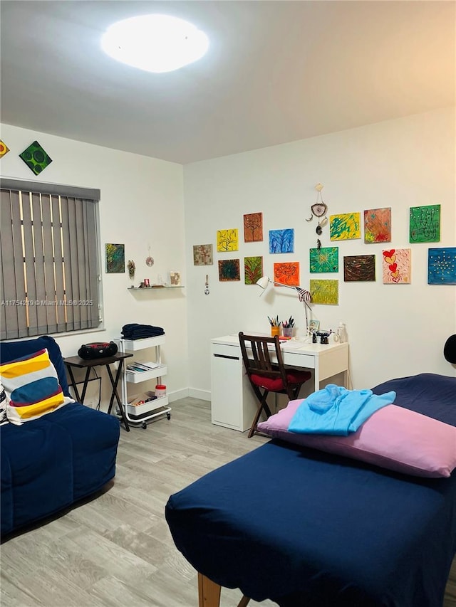 415 SE 11th Ter Unit 205, Dania Beach, FL 33004 - bedroom featuring wood finished floors and baseboards