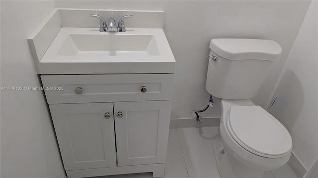 half bathroom featuring toilet and vanity