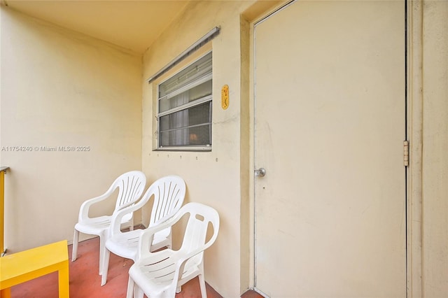 doorway to property with stucco siding