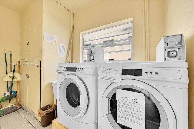 laundry area featuring laundry area, light tile patterned flooring, and independent washer and dryer