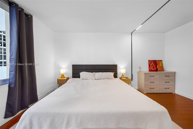 bedroom featuring wood finished floors