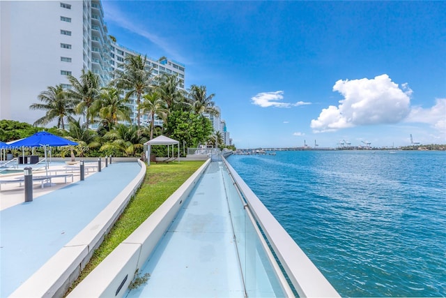 exterior space featuring a gazebo and a water view