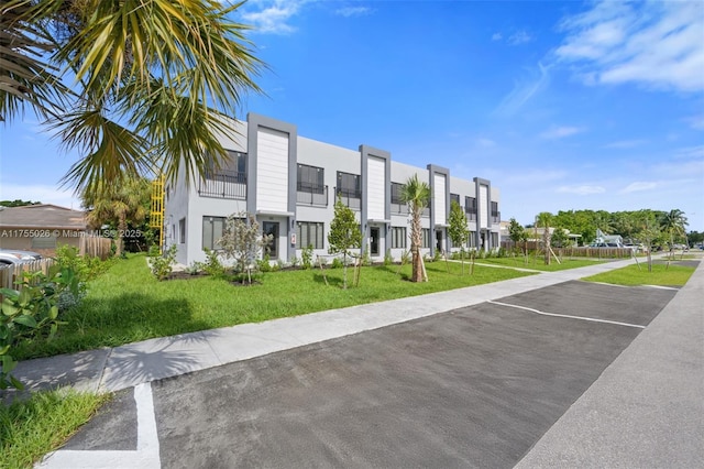 exterior space featuring a residential view and uncovered parking