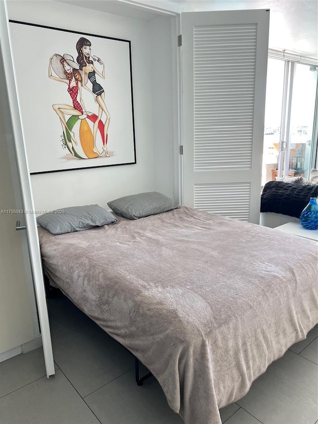 bedroom with tile patterned floors