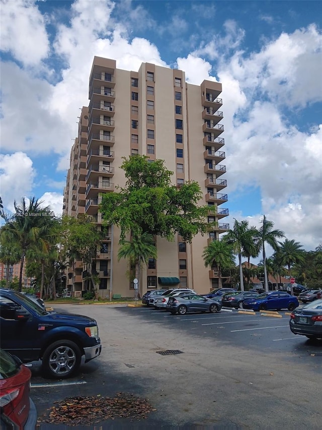 view of property featuring uncovered parking