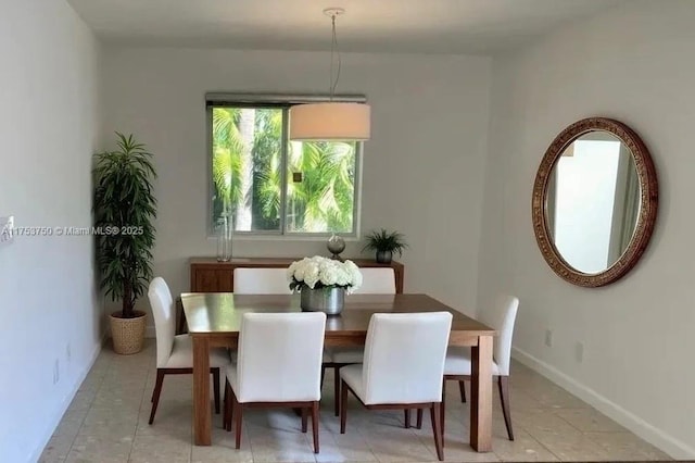 1323 NE 5th Ave, Fort Lauderdale, FL 33304 - dining room featuring baseboards and light tile patterned flooring