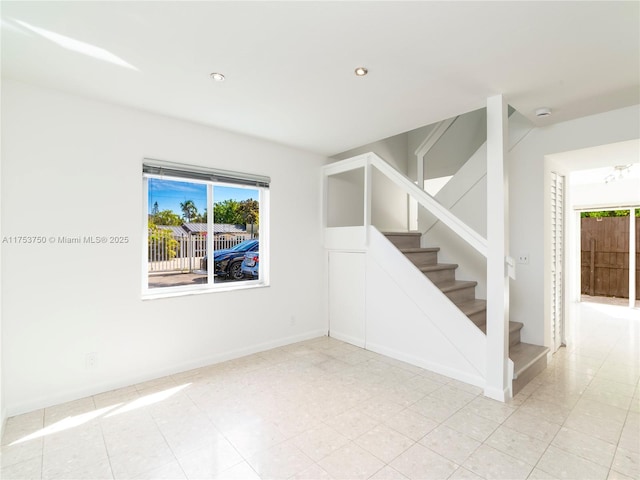 1323 NE 5th Ave, Fort Lauderdale, FL 33304 - empty room featuring stairway, healthy amount of natural light, recessed lighting, and baseboards