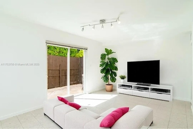 1323 NE 5th Ave, Fort Lauderdale, FL 33304 - living room featuring baseboards